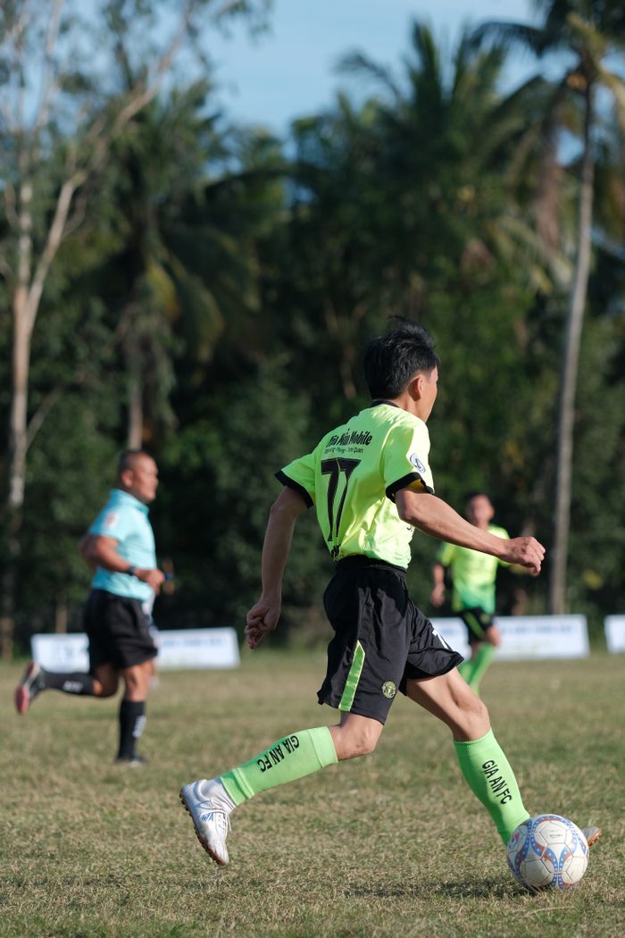 services-02 Dynamic soccer scene with players in action on a sunny day.